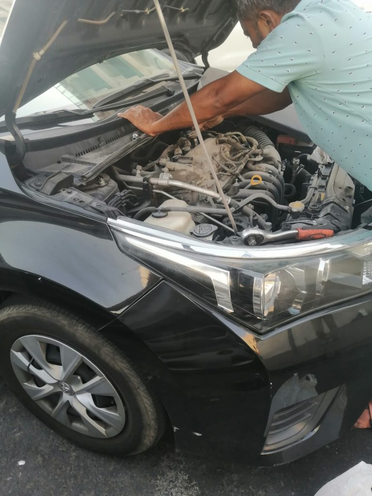 Replacing dead car battery with new one